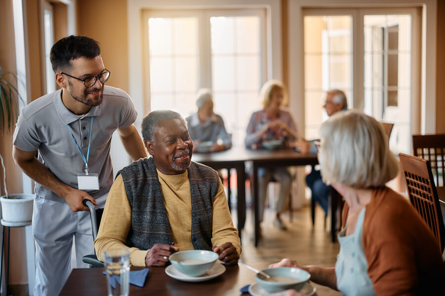 A carer sharing a warm conversation with a resident